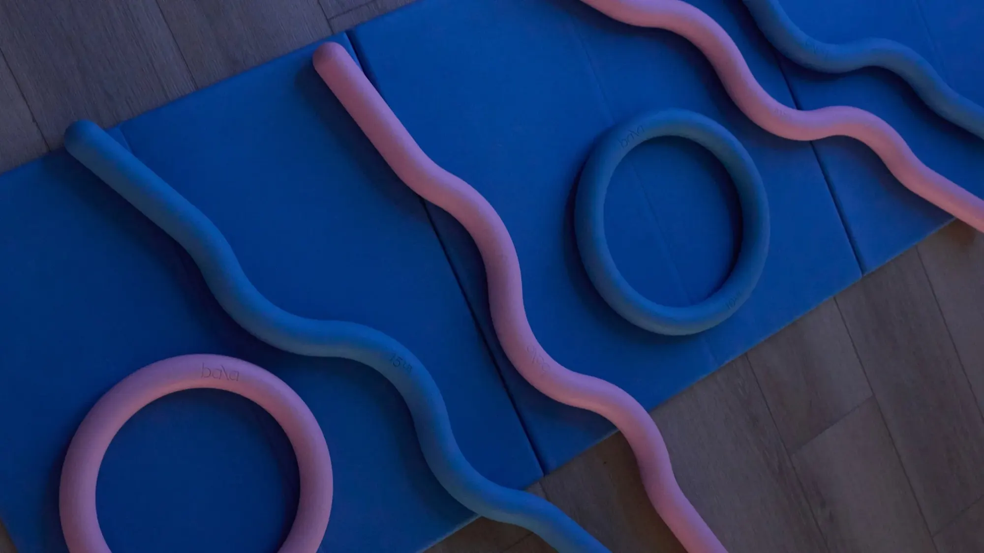 Pink and blue wave props on a blue mat